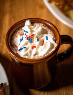 Hot cocoa with whipped cream and sprinkles